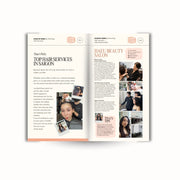 Open magazine or book with hair salon article and photos on a white background